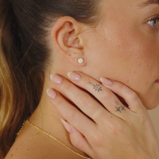 Woman Wearing Opal Earring Studs