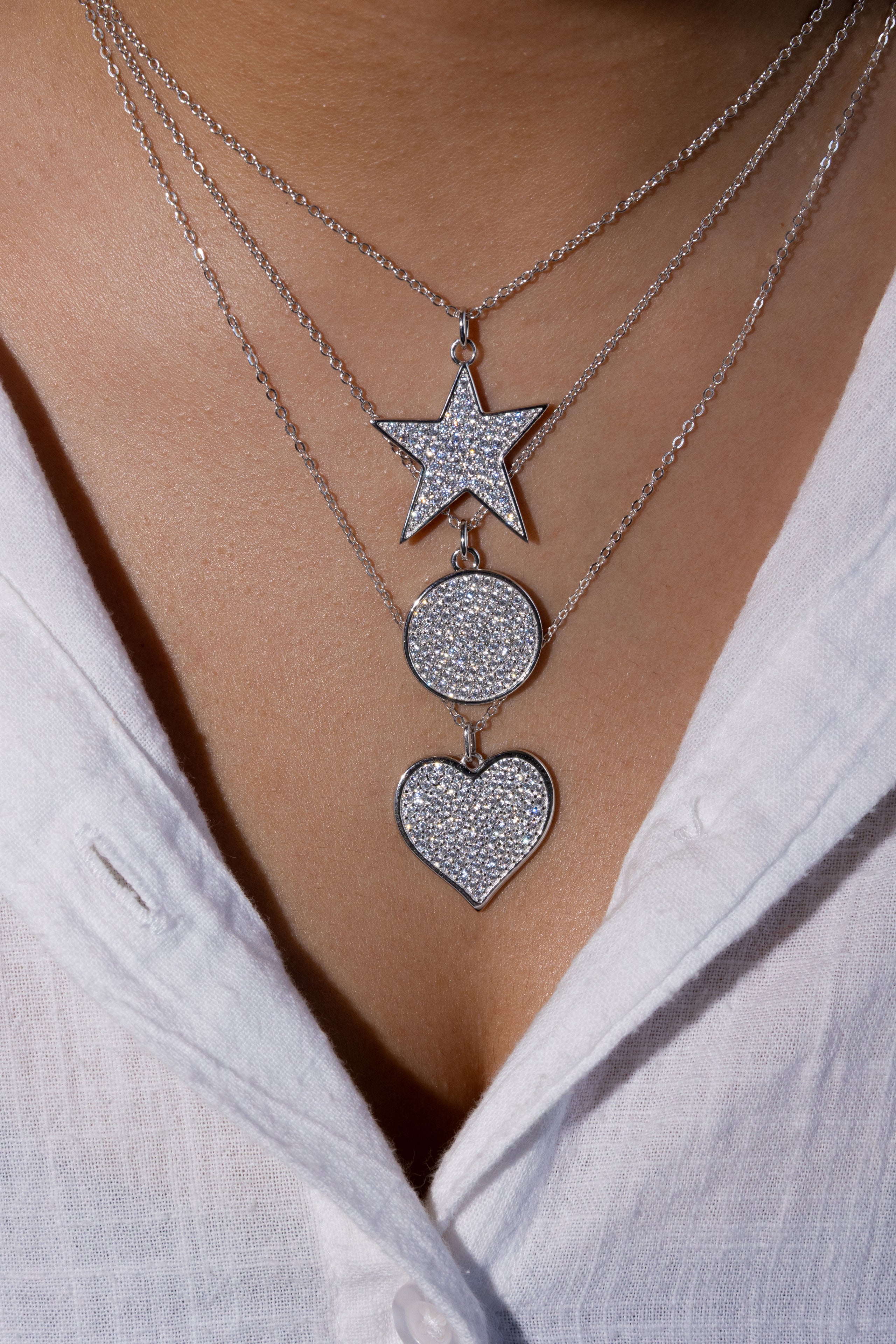 Jewelry shop FAQ page featuring a model and photographer during a studio session