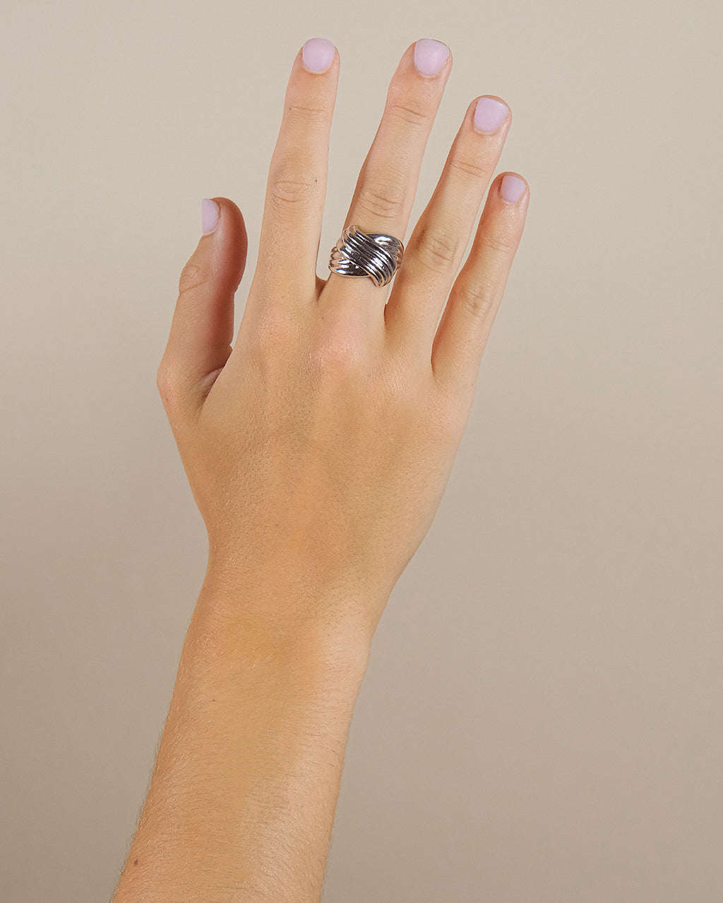 wearing Plié silver ring