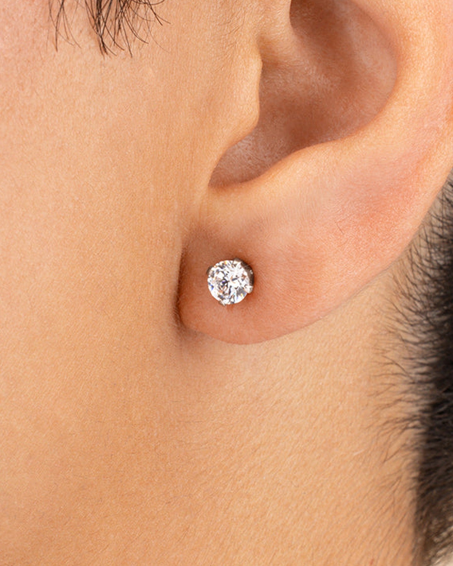 Sterling Silver 5mm CZ Stud Earrings worn on ear