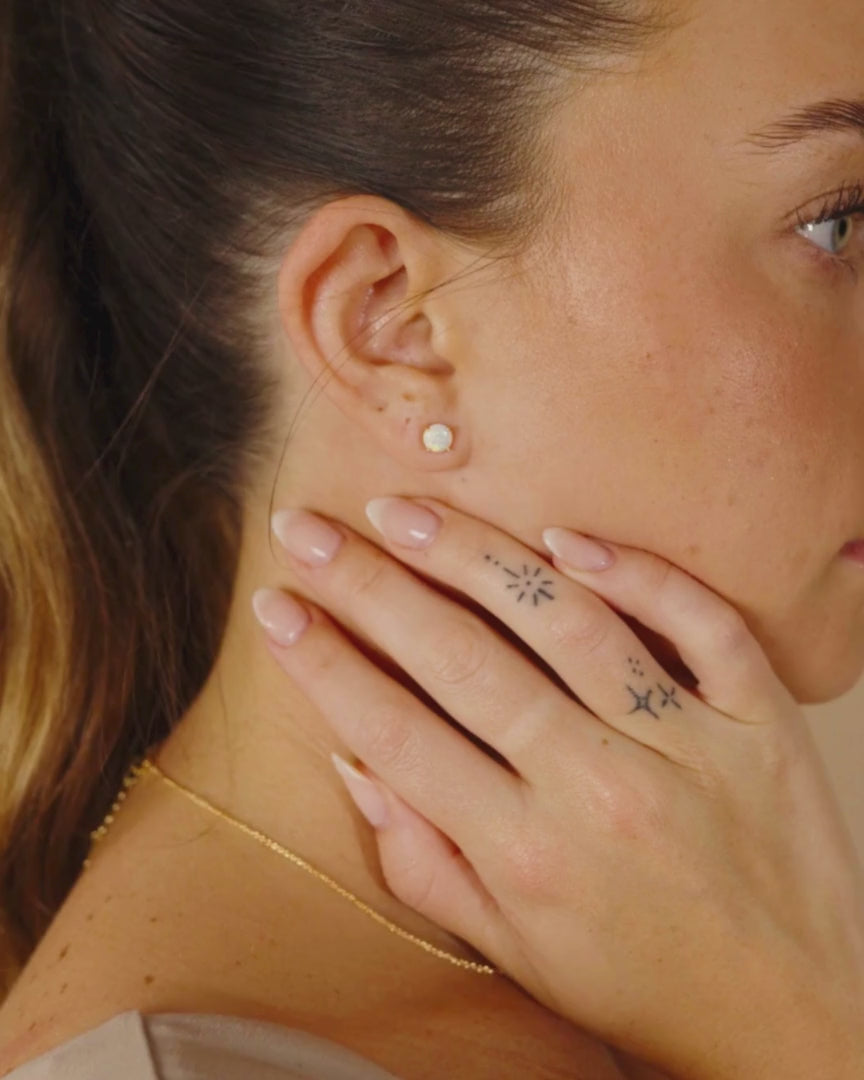 Woman Wearing Opal Earring Studs