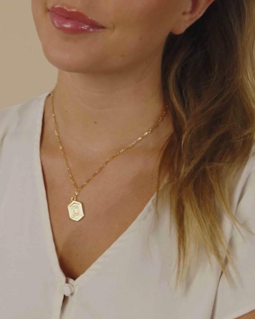 Woman Wearing Hexagon Tag Initial Pendant Necklace