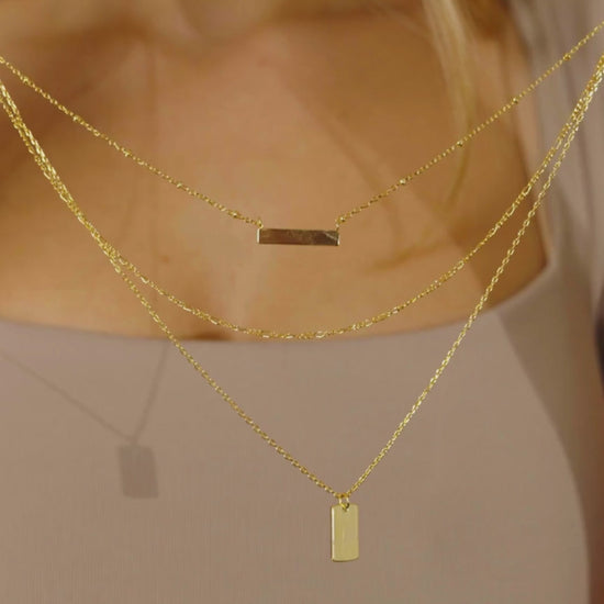 Girl Wearing Triple Layered Bar Necklace