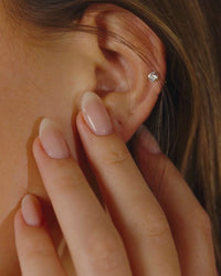 Woman Wearing Silver CZ Stud Earrings