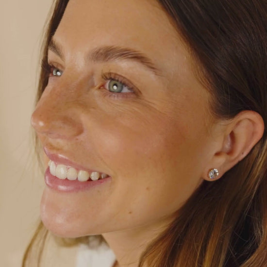 Woman Wearing Silver CZ Stud Earrings