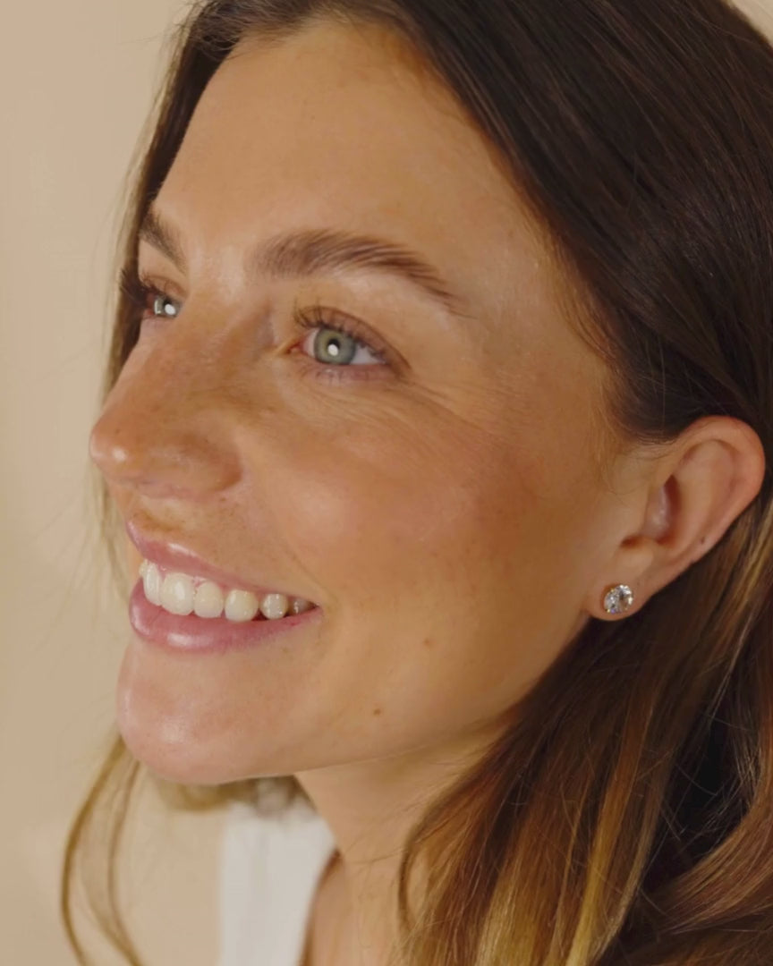Woman Wearing Silver CZ Stud Earrings